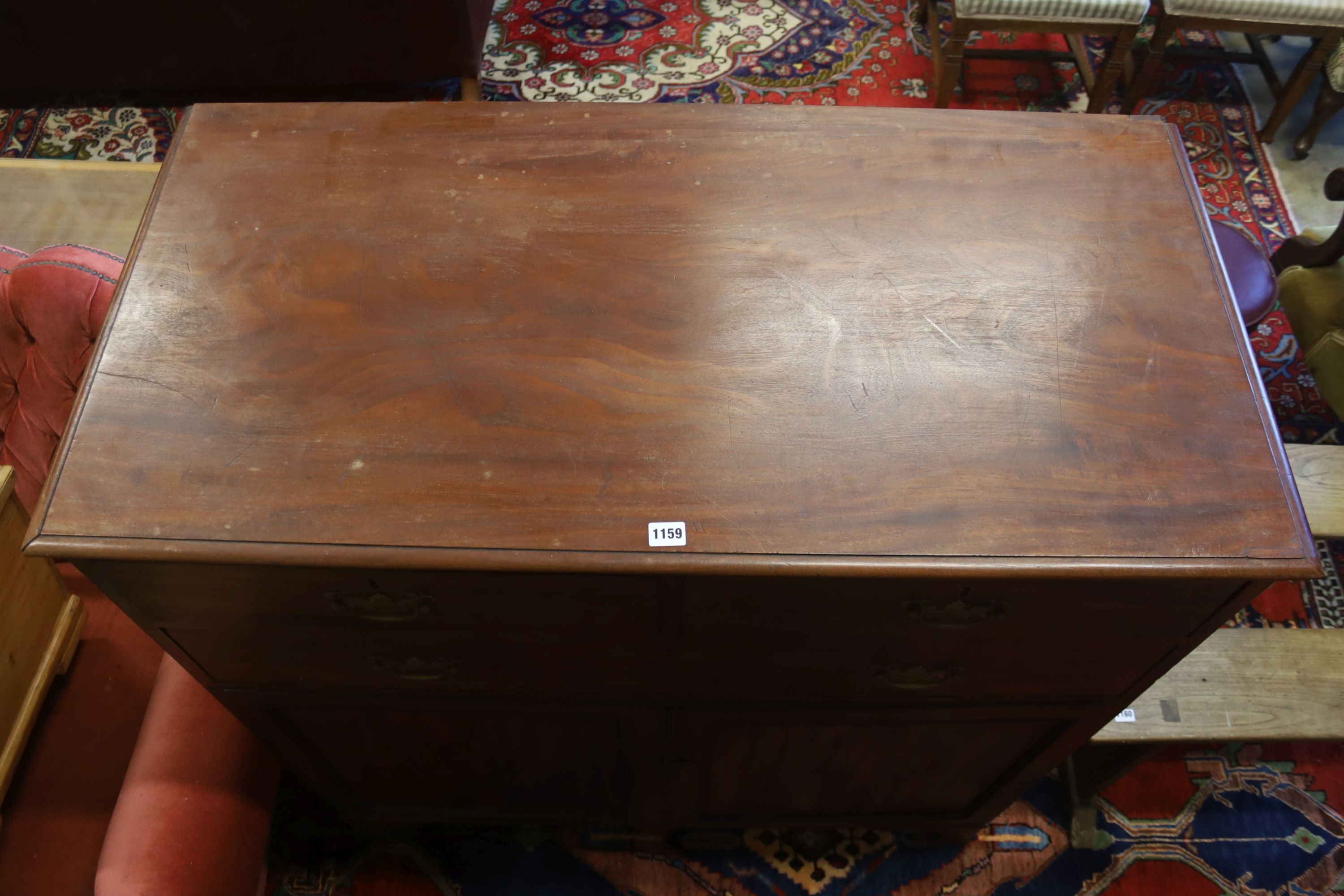 A George III style mahogany three drawer press cupboard, width 114cm, depth 57cm, height 124cm